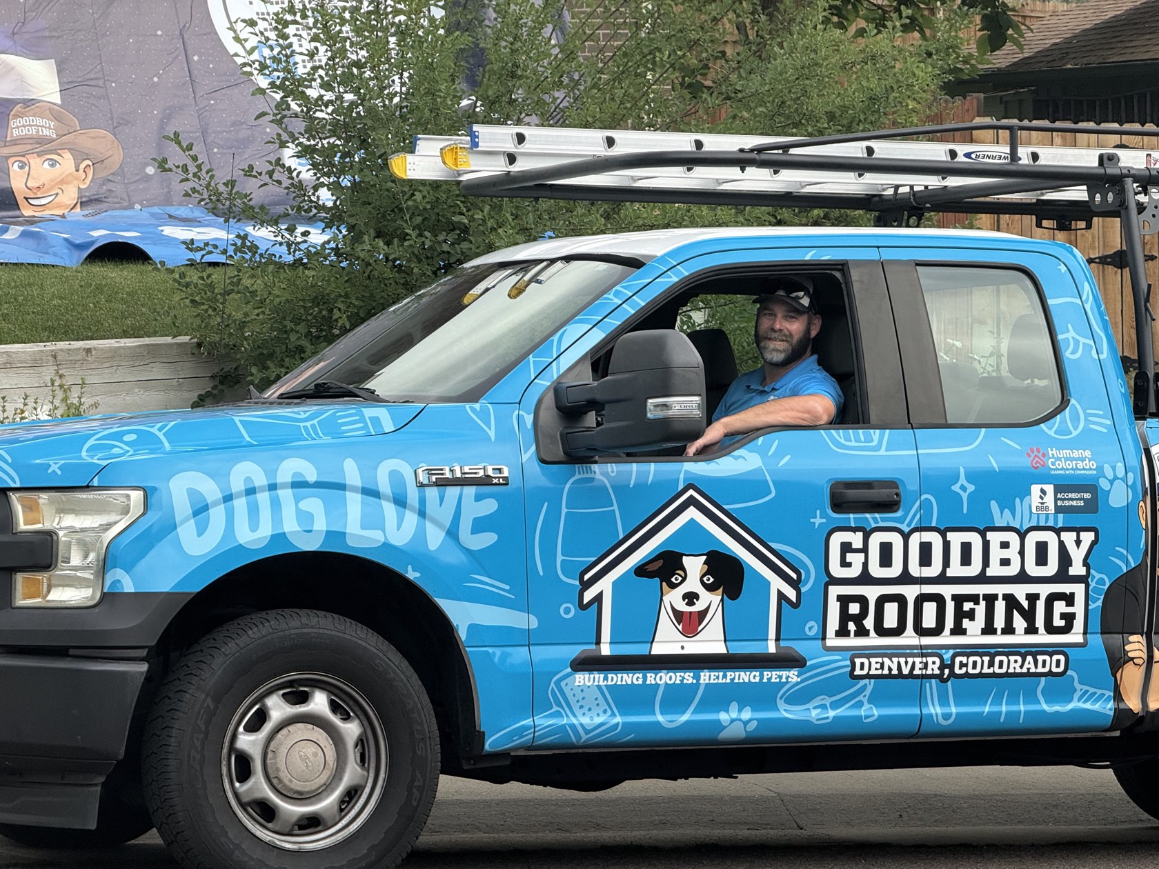GoodBoy Roofing owner in the company's branded truck in Denver