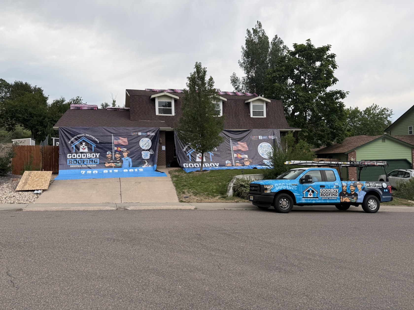 GoodBoy Roofing branded truck at a home in the Denver metro area